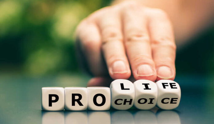shutterstock_1759247294.jpg featured image Hand shifting blocks spelling pro life to pro choice