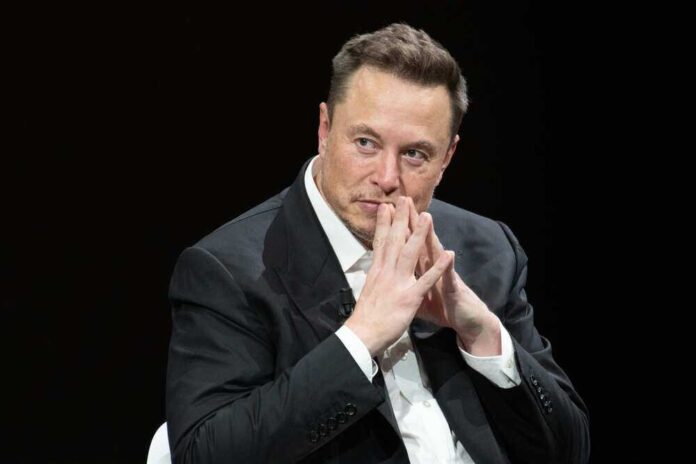 shutterstock_23188002871.jpg featured image Elon Musk in suit thinking.