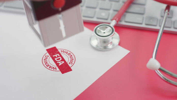 shutterstock_1795453510.jpg featured image FDA warning stamp near stethoscope and keyboard