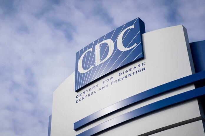 shutterstock_2123545061.jpg featured image CDC building sign against a cloudy sky.
