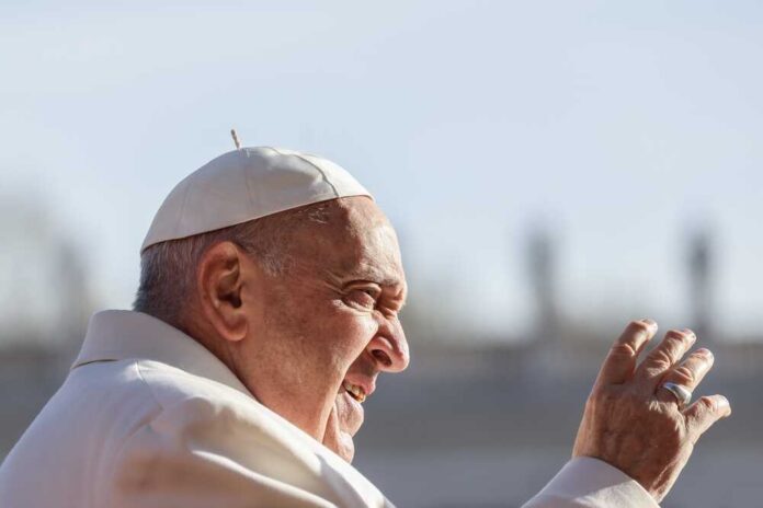 shutterstock_22827652971.jpg featured image Pope Francis waving outdoors.