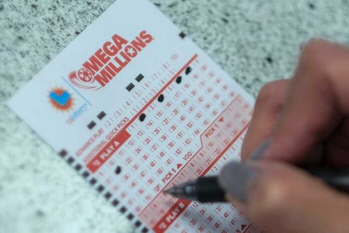 shutterstock_2342568937.jpg featured image Person filling out lottery numbers on ticket