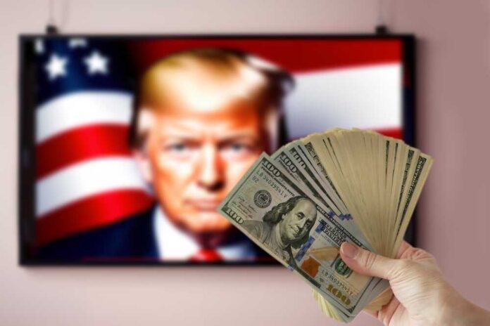 shutterstock_2518625675.jpg featured image Hand holding cash in front of American flag background with Donald Trump's face