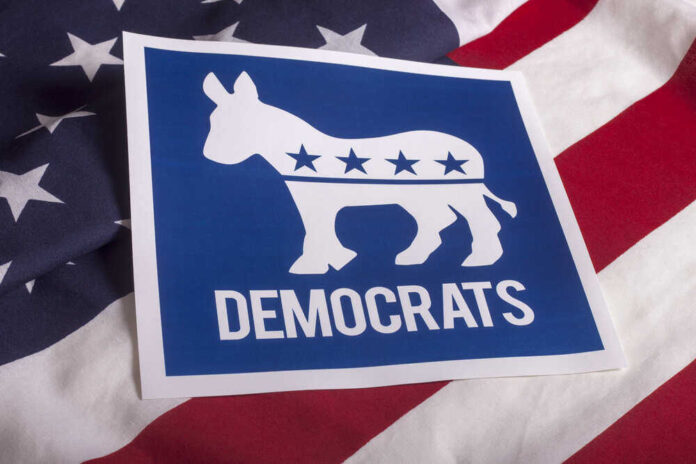 shutterstock_3058522131.jpg featured image Democratic Party logo on American flag background.