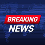 Breaking News text on world map background.