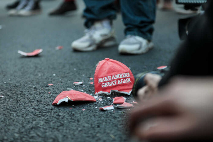 shutterstock_1846878058.jpg featured image Broken Make America Great Again hat on pavement.