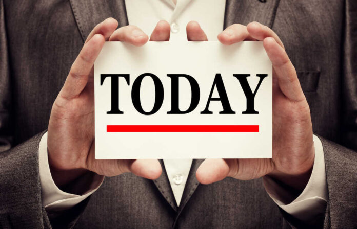 shutterstock_220852645.jpg featured image Person holding sign with the word today