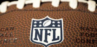 Close-up of NFL logo on American football.