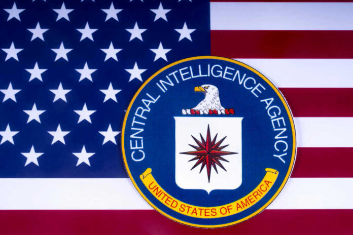 shutterstock_1051373186.jpg CIA emblem over United States flag background
