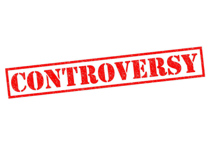 shutterstock_186387446.jpg Controversy stamp in bold red letters