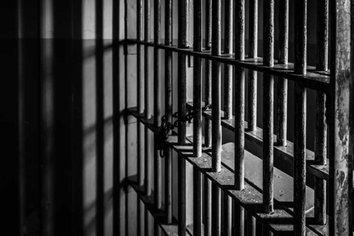 shutterstock_7243457532.jpg Prison Cell Bars