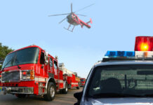 Fire truck police car and helicopter at scene