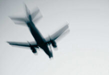 Airplane in flight with motion blur