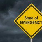 EMERGENCY DECLARED: Liberal Governor Now Alarmed Yellow warning sign reading State of Emergency