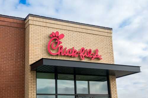 Chick-fil-A restaurant sign on a brick building