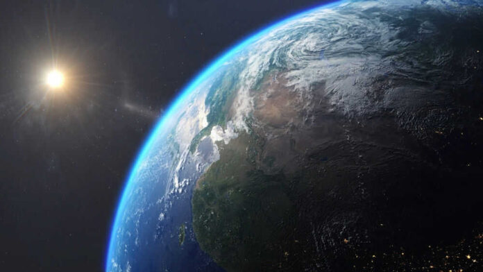 Earth from space with sun in background