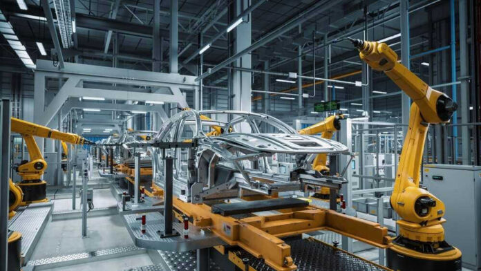 Car assembly line with robotic arms in a factory