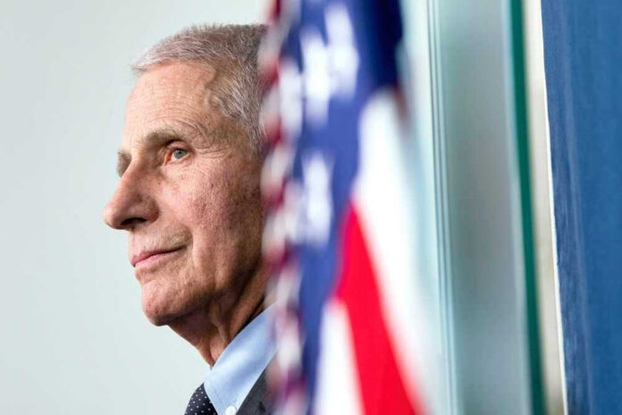 Anthony Fauci close up with flag