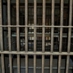 VIDEO: Serial Killer’s Shocking Reign of Terror Empty, rusty barred jail cell with metal bunks