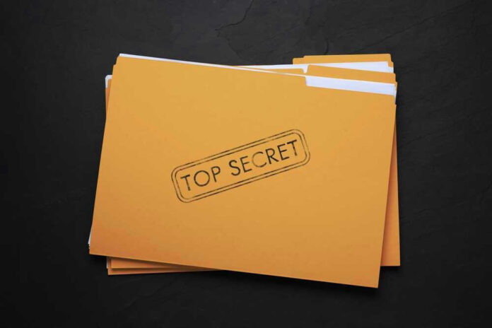 Yellow folder labeled Top Secret on black background