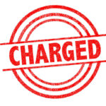 Teen Faces SHOCKING Murder Charges Red charged stamp with circular border