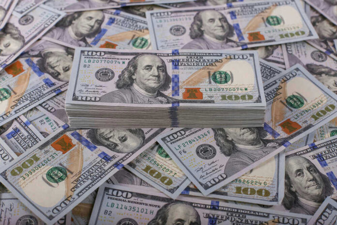 Stack of one hundred dollar bills, Benjamin Franklins portrait.