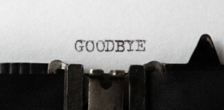 Typewriter with paper saying GOODBYE