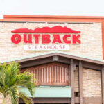 Outback Steakhouse Accused — Dangerous Toilet? Exterior view of an Outback Steakhouse restaurant with a prominent sign