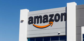 Exterior view of an Amazon building with a prominent logo