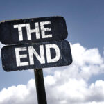 An Amazing Career Ends — The ‘Oracle’ Has Retired A weathered sign displaying the words 'THE END' against a cloudy sky