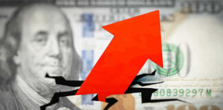 Red arrow on cracked $100 bill.