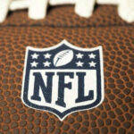 Close-up of NFL logo on American football.