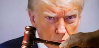 Gavel in front of Donald Trumps face on screen.