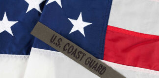 U.S. Coast Guard patch on American flag.