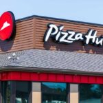 Massive Pizza Hut Purge Begins Now Exterior view of a Pizza Hut restaurant with a prominent logo