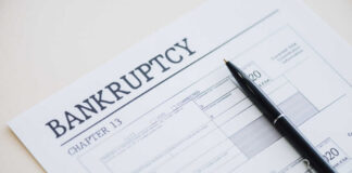 Bankruptcy Chapter 13 form with a pen resting on it