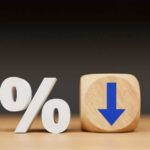 A percentage symbol next to a wooden block with a downward arrow
