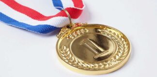 Gold medal with a red, white, and blue ribbon