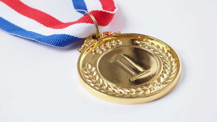 Gold medal with a red, white, and blue ribbon