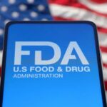FDA’s Highest Alert: Blueberries Hide Death Risk FDA logo displayed on a smartphone with an American flag background