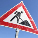 Warning sign indicating construction work ahead