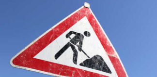 Warning sign indicating construction work ahead