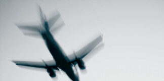 Airplane in flight with motion blur.