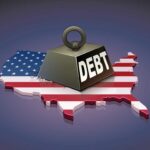 A heavy weight labeled 'DEBT' sits on a map of the United States, symbolizing economic challenges.