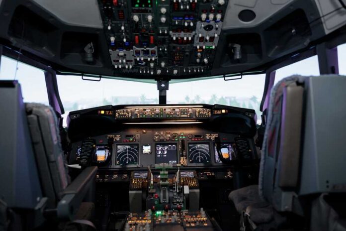shutterstock_2205307307.jpg Interior view of an airplane cockpit with various instruments and controls