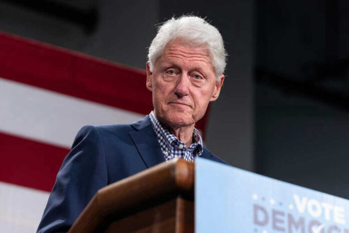 Bill Clinton speaking at podium.