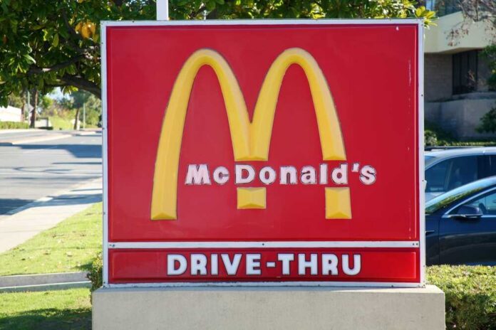shutterstock_2409014649.jpg McDonald's drive-thru sign with iconic golden arches