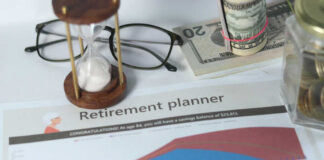 Retirement planner graph with money glasses hourglass