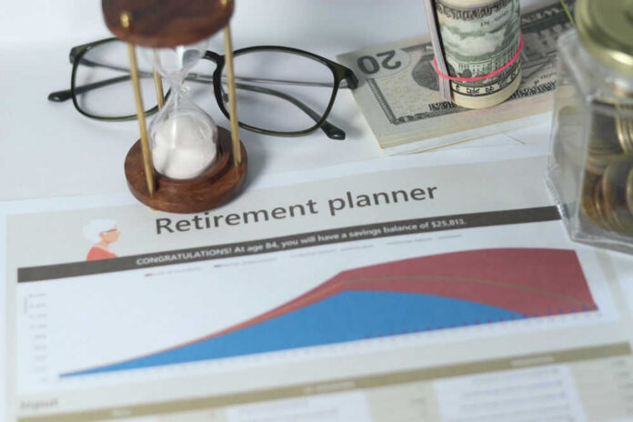 Retirement planner graph with money glasses hourglass