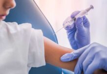 A healthcare professional administering a vaccine to a child's arm